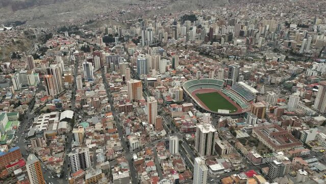 Aerial Drone Above Stadium Hernando Siles in La Paz, Bolivia, Populated City in South America, High Altitude Neighborhood below Andean Cordillera Mountain Rainge