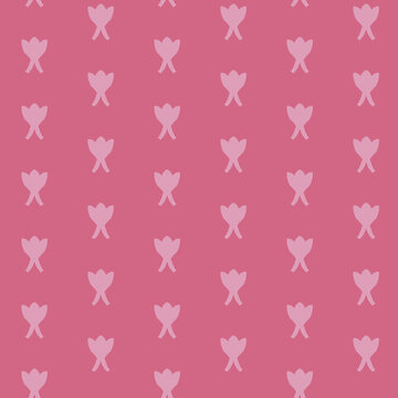 Seamless pattern of symmetrical floral arrangement on pink background
