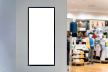 Mockup vertical advertising signboard on wall of clothing shop - 565022608
