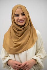 Portrait of young muslim woman wearing hijab on isolated white background