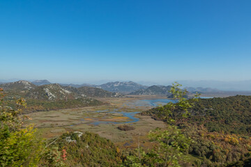Panoramic view of Lake Skadar National Park in autumn near tourist village Virpazar, Bar, Montenegro, Balkans, Europe. Travel destination in Dinaric Alps near Albania. Stunning landscape and nature