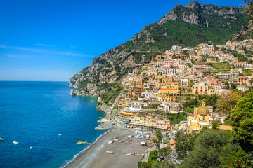 Above Positano city cliffs and marina with boats and yacht, amalfi coast, Italy