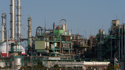Fototapeta na wymiar The petrochemical complex at Yokkaichi Port at daytime. 