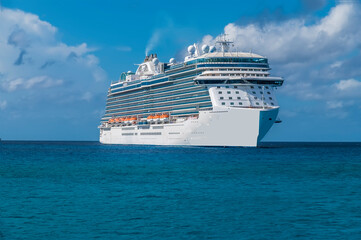 A view of a cruise ship moored on the island of Eleuthera, Bahamas on a bright sunny day