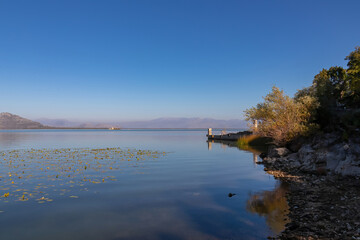 Panoramic view from the lakeshore of Lake Skadar National Park in autumn seen from Godinje, Bar, Montenegro, Balkans, Europe. Stunning travel destination in Dinaric Alps near Albanian border. Hiking