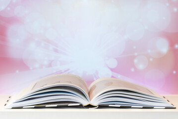 Open magic book on the table.