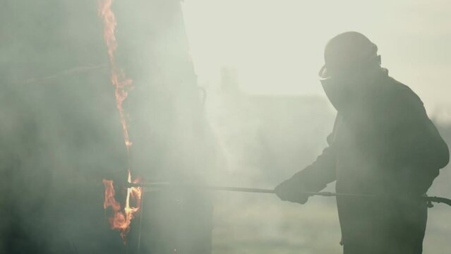 Construction torcher cutting through metal pieces