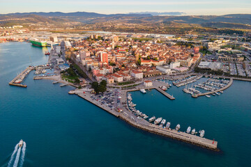 Exciting summer view from flying drone of Koper port. Aerial outdoor scene of Adriatic coastline, Slovenia, Europe. Splendid Mediterranean seascape. Traveling concept background.