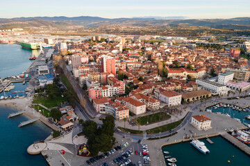 Fototapeta na wymiar Exciting summer view from flying drone of Koper port. Aerial outdoor scene of Adriatic coastline, Slovenia, Europe. Splendid Mediterranean seascape. Traveling concept background.