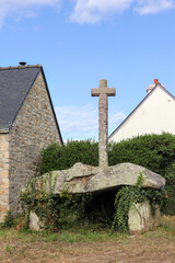 Fototapeta na wymiar Dolmen Cruz-Menquen in Carnacu in Brittany with a christian cross