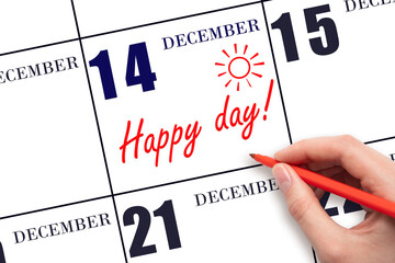 Hand writing the text HAPPY DAY and drawing the sun on the calendar date December 14