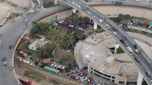 Aerial View Of Jinnah Flyover Over Rotary Food Park In Karachi. Dolly Ascending Shot