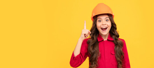 happy teenager girl in safety hard hat inspired with idea, inspiration. Child builder in helmet horizontal poster design. Banner header, copy space.
