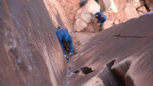 Climbing in American Desert, Top Down View of Climbers and Ropes in Indian Creek Utah USA, Slow Motion