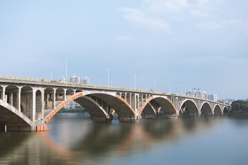 Fototapeta na wymiar The architectural bridge next to Dongjiangsha Park in Huizhou