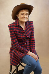 woman wearing cowboy hat and checked shirt