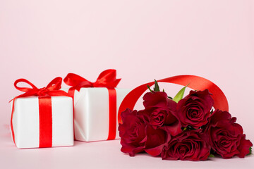 Valentines day gift box with red roses on white table
