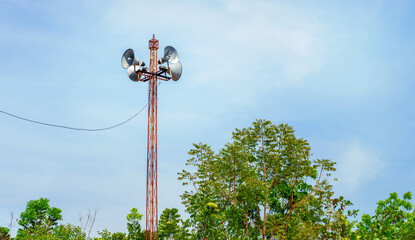 Megaphones on a pole in nature forest background, Old style public address system, speakers on high...