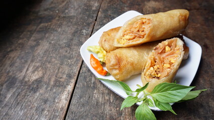 Lumpia rebung or bamboo shoot spring rolls, commonly found in Indonesia and Philippines. Made of thin crepe pastry skin and the inside is filled with bamboo shoots and minced chicken.