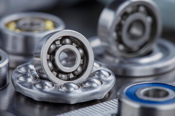 Obraz premium different bearings on a metal background. Part of mechanism.