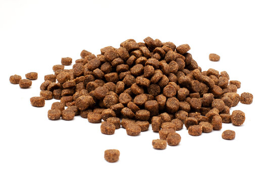 Scattered cat food isolated on a white background. A lot of feed