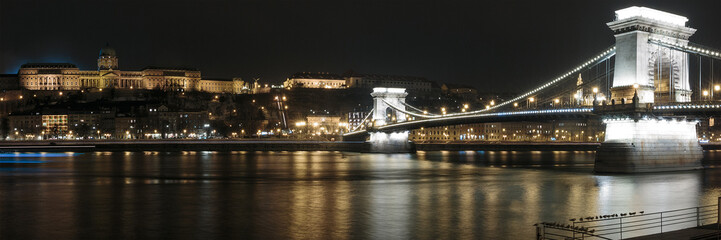 Panorama of the Széchenyi Chain Bridge of Budapest across the river Danube lit up at night