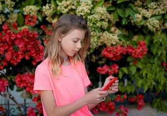Beautiful young hipster girl using smart phone.