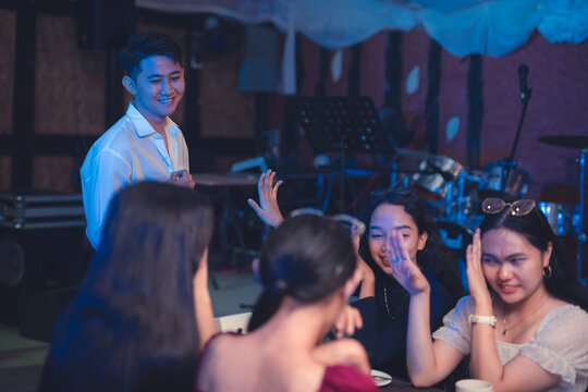 An overconfident guy shows off his looks to a group of women. Ladies cringe at a cocky man who has been bragging about his wealth. Girls reject a man making a move on them as they are annoyed by him.