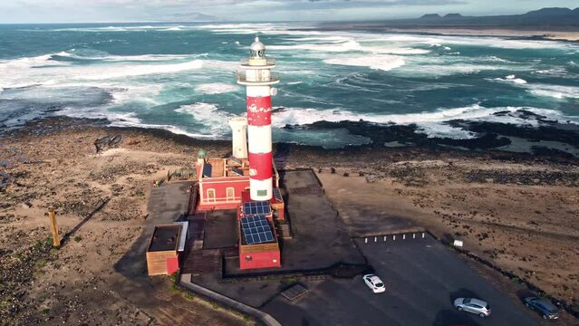 Historic Toston Lighthouse On The Canary Island Of Fuerteventura In Spain With Stunning Ocean Views. aerial orbit