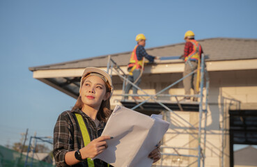 Portrait of a young beautiful engineer woman working in a construction building. Close-up of a...