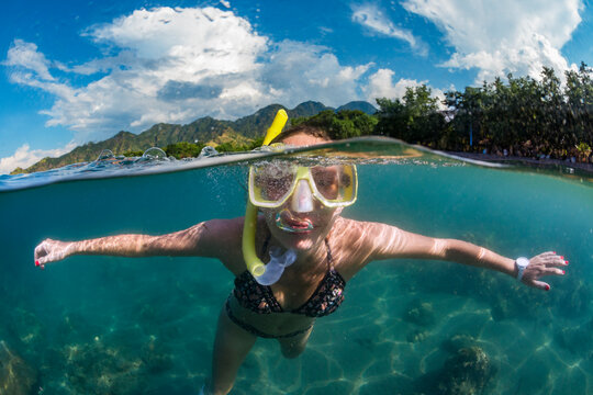 Woman snorkeling underwater,Â Perebutan, Bali, Indonesia