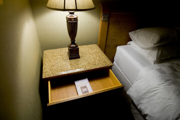 A copy of The Koran is found in the bedside table of a hotel room in Singapore.