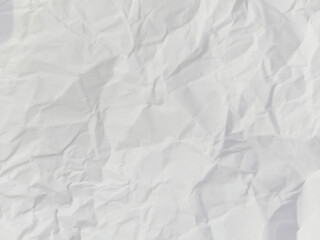 Abstract wrinkled or Free photo crumpled white paperboard or empty canvas or paper surface with folded stains.	