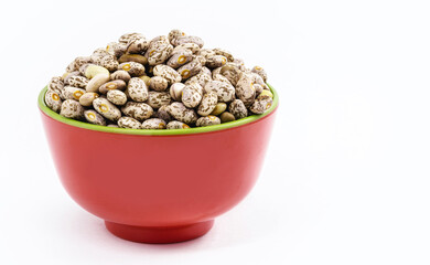 small portion of brazilian beans on isolated white background, pot with raw bean seeds, isolated on white background , Brazillian tipical food