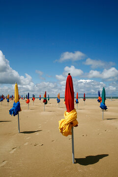Colorful umbrellas on the beach in Deauville. Normandy, France.