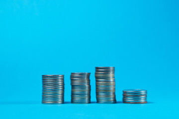 Coins on a blue background. Business and finance concept