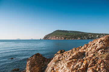 Fototapeta na wymiar Beautiful sea landscape with island, blue sky, sunlight and blue water