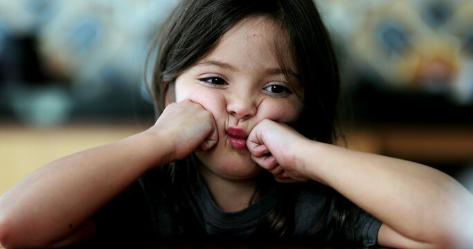 Upset child sad small girl crossing arms unhappy kid