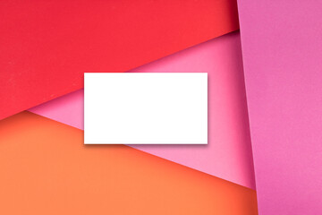 Business card blank over colorful background. Copy space for text. Top view.Business card blank over colorful abstract background. Corporate stationery branding mock-up. Copy space for text. Top view.