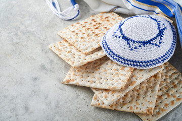 Passover celebration concept. Matzah, red kosher and walnut. Traditional ritual Jewish bread...