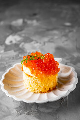 Canape with brioche, butter, salmon red caviar.