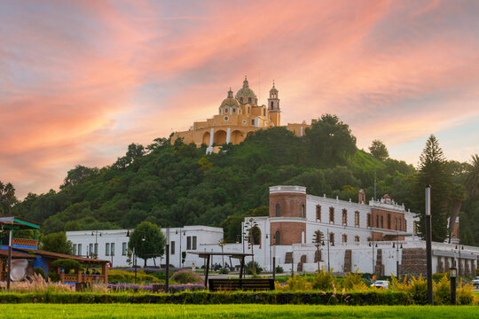 Los Remedios Sanctuary in Cholula Puebla on a hill, with the sunset in the background