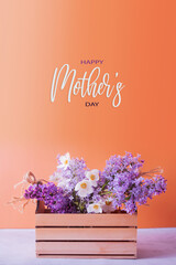 Happy Mothers day greeting card with Lilac and anemones flower bouquet in wooden box