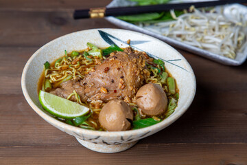 
noodles on wooden background, Asian junk food concept, vegetables udon noodles, bowl on a wood table with copy space, Space for text, Soba noodles
