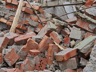 pile of broken red brick, the concept of destruction, the tragedy of war, an earthquake