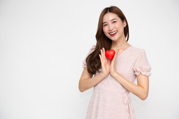 Young Asian woman holding red heart isolated on white background, Valentine day concept