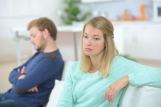 an unhappy couple at home