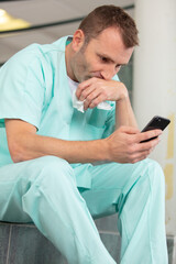 modern medical surgeon using smart phone