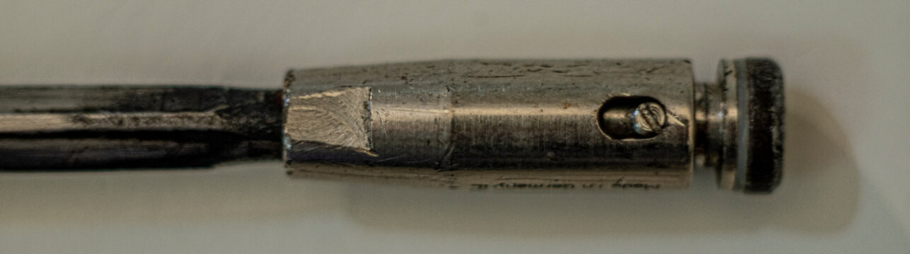 closed up of epee blade tip on white background. Fencing equipment