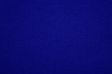 Texture of dark blue fibrous paper, cardboard, close-up. Background, embossed surface. Copy space.	
